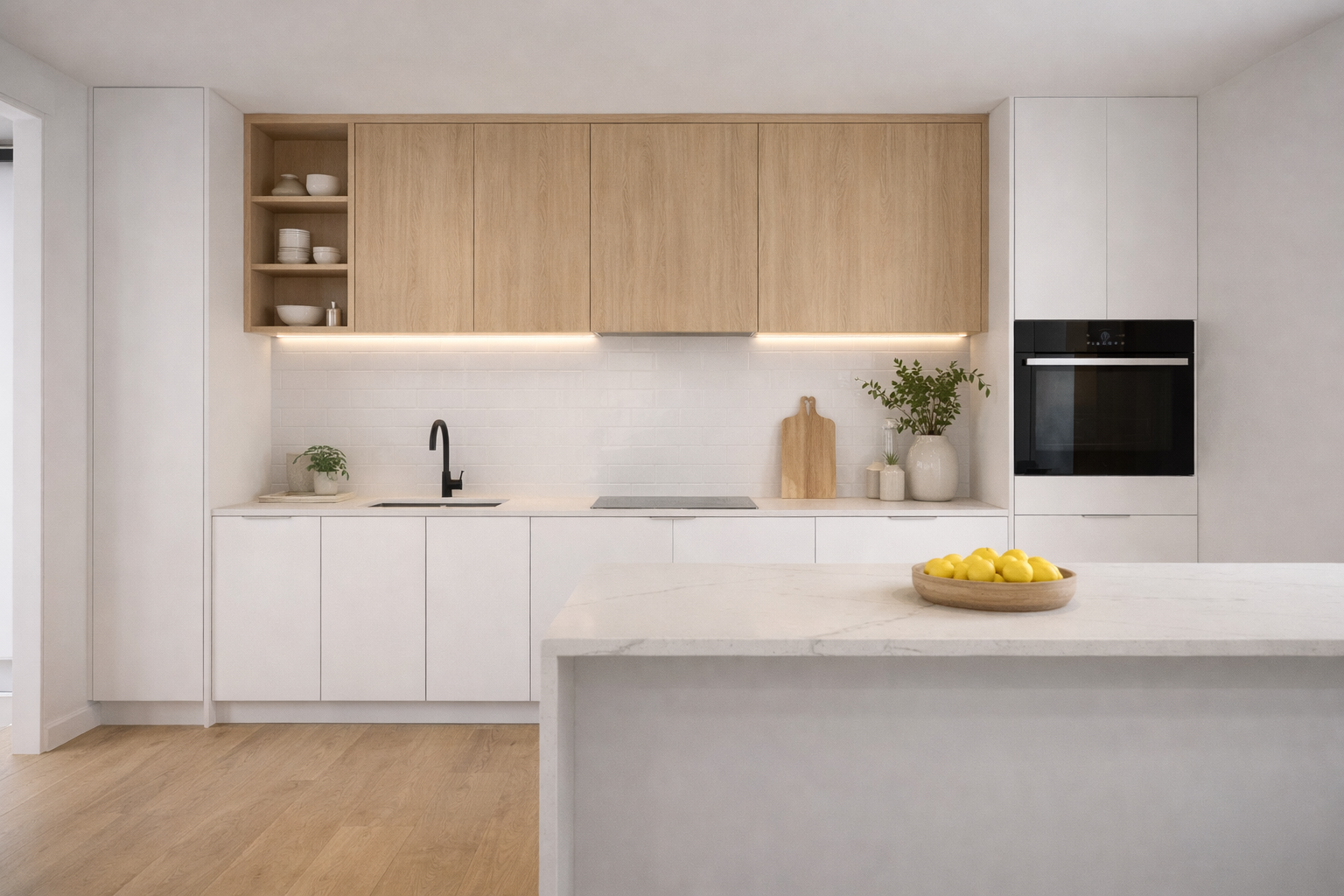 Custom kitchen cabinetry with white stone benchtop, timber overheads and handleless doors in a Melbourne home